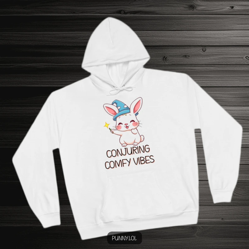 Funny hoodie featuring a rabbit with a wizard hat conjuring a sparkle, for magical coziness.
