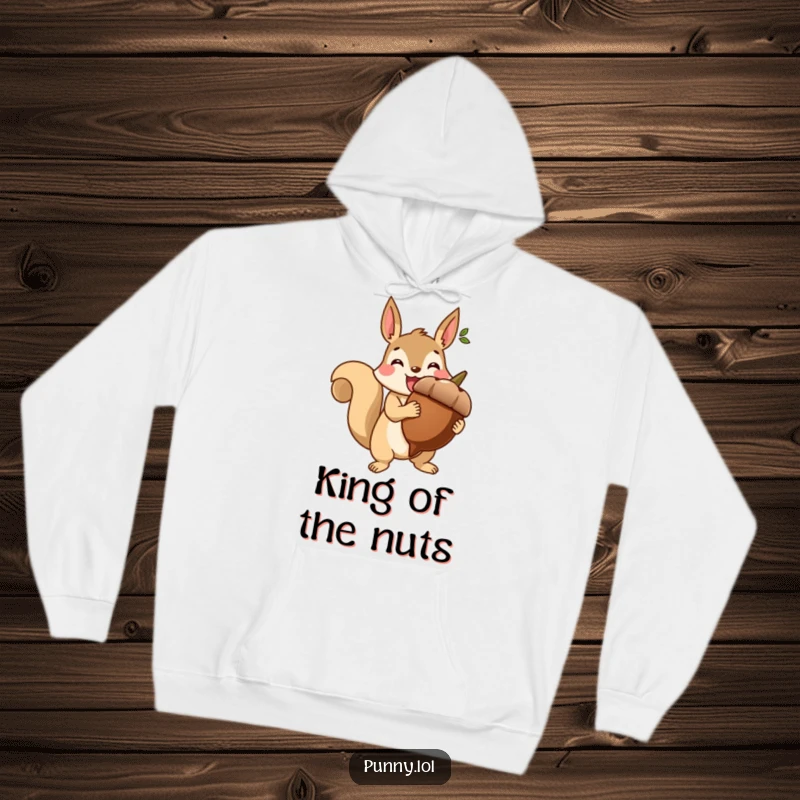 Funny hoodie featuring a beaming squirrel holding a giant acorn like a trophy, designed for cozy celebration.