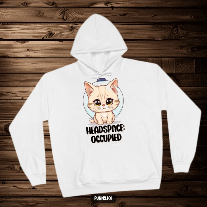 Funny hoodie showing a confused cat trying to wear a fishbowl as a helmet, offering warmth and smiles.