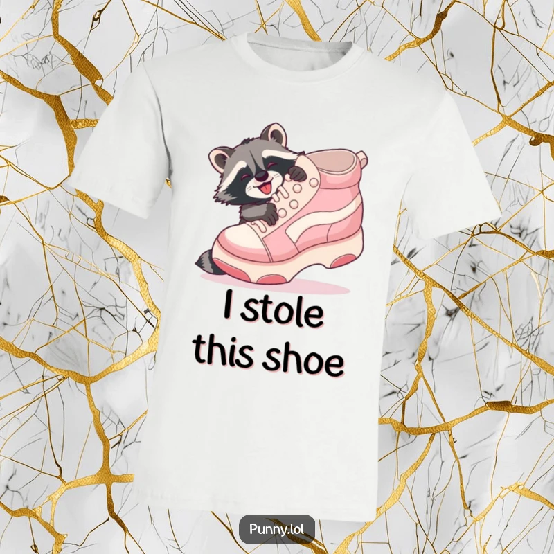 Funny Raccoon Shoe Hug T-Shirt: A playful raccoon gleefully embraces a giant inflatable shoe with joy.